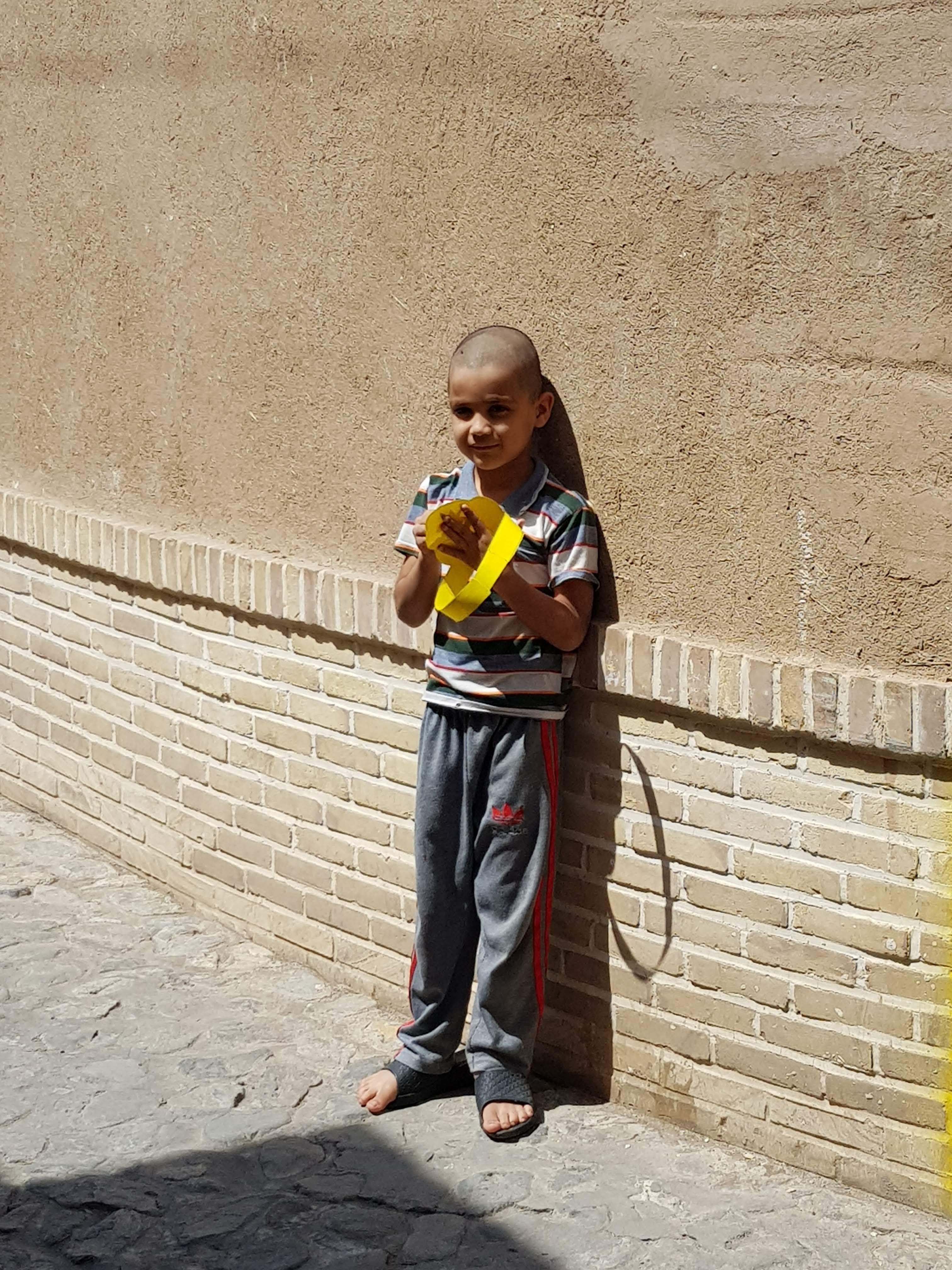 ^ A boy I met in Kashan 2015 - he was holding a paper crown under the sun.